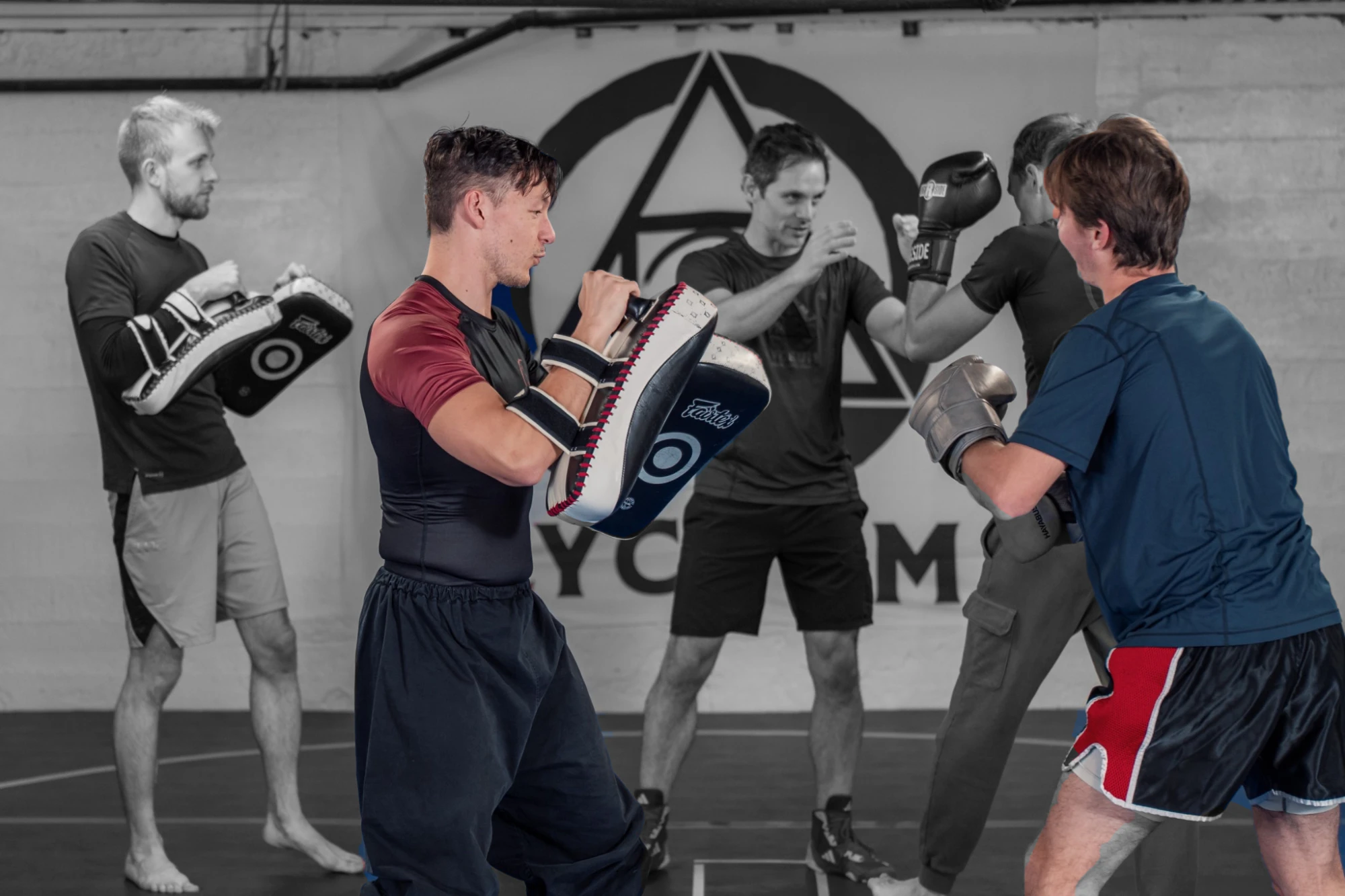 Partners practicing striking with pads